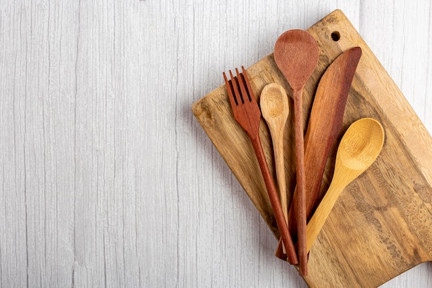 Wooden cutlery on wooden table