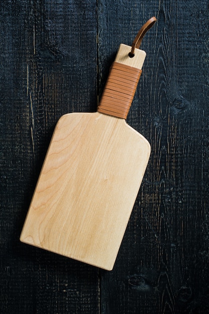 Wooden cutting Board on black.