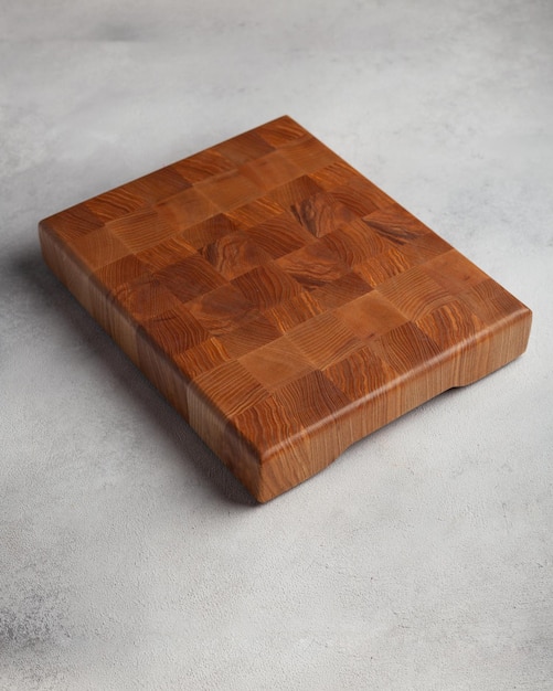 Photo wooden cutting board in the kitchen on a light background