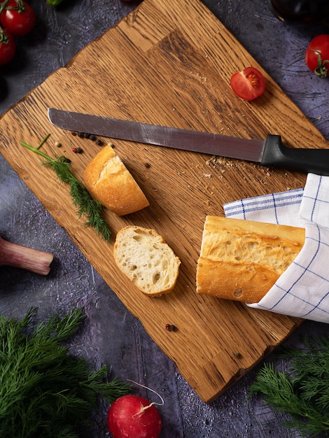 Wooden cutting board linen textile and cutlery Food background with copy space