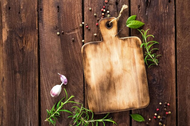 A wooden cutting board with a wooden cutting board and a wooden cutting board with herbs on it.