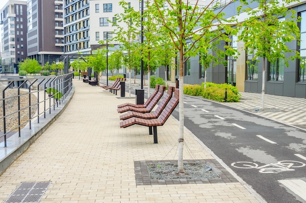 Wooden deck chairs for relaxing on the street in a residential area.