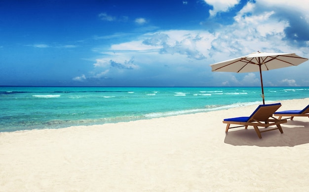 Wooden deck chairs on sandy beach near sea. Holiday background.