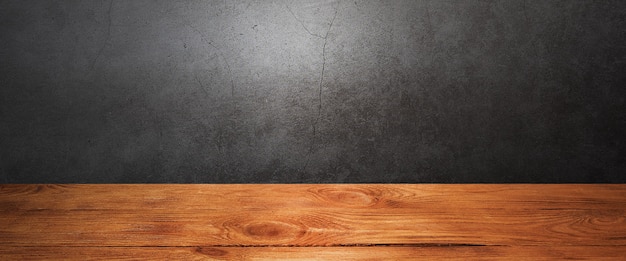 Wooden decking table on a grey grunge background. Place for an item, logo, or label. Layout, mockup.