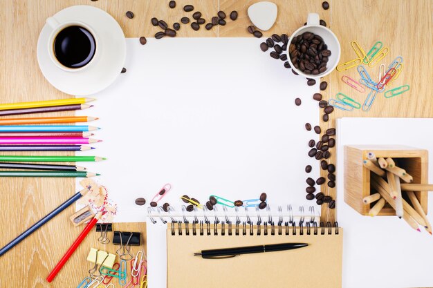 Wooden desk with blank paper