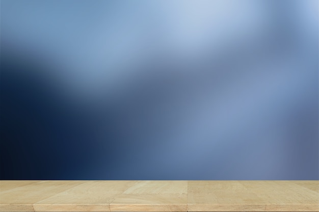 Wooden desk with Blurred Lights on blue background or Lights on blue background.