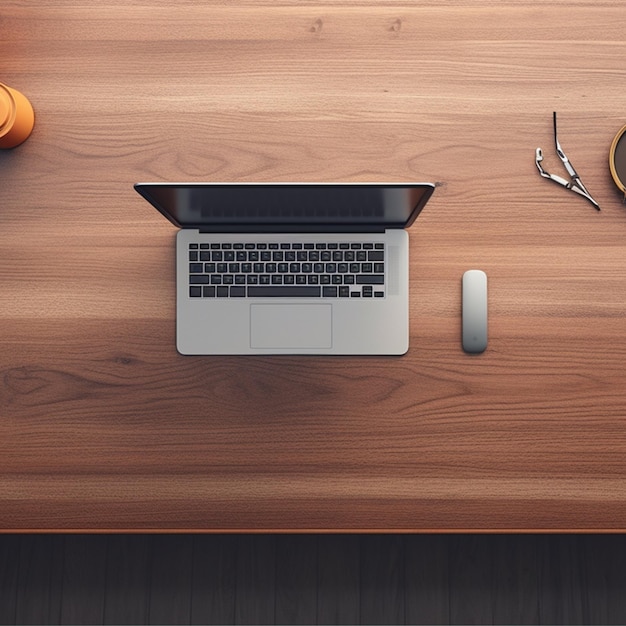 A wooden desk with a laptop mouse mobile phone charger and books