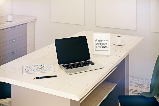 Wooden desktop with empty laptop