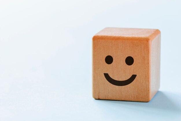 Wooden dice with happy smiley face