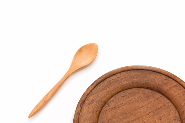 Wooden dish and spoon set isolated on white