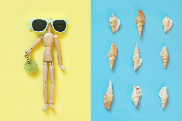 Wooden doll with sunglasses on yellow. Uv protective.