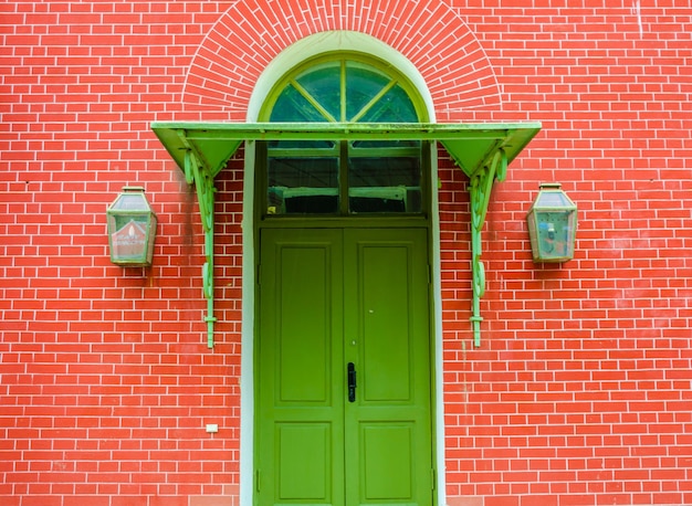 A wooden door in a brick wall