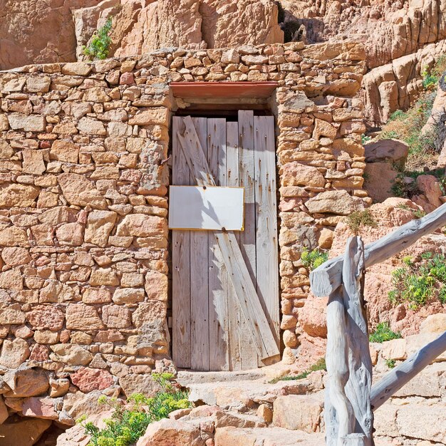 Wooden door in a rocky wall