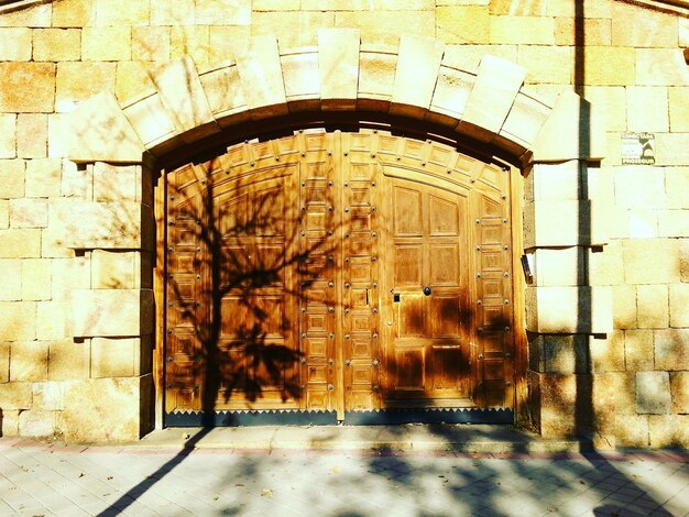 Wooden door on stone wall