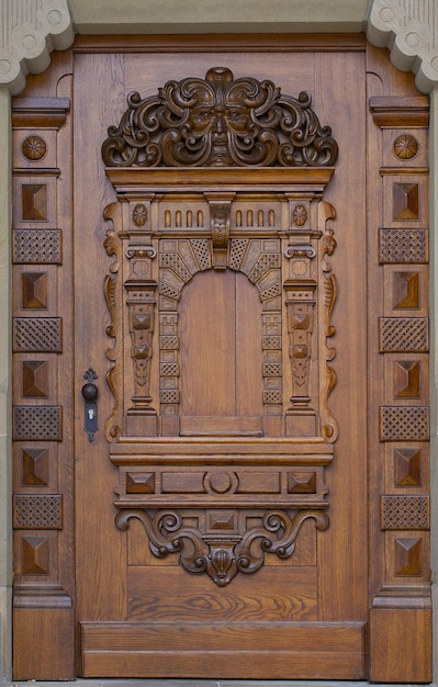 A wooden door with a carved frame and the word love on it.