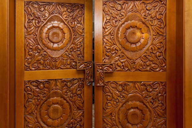 Wooden door with carved handmade patterns interior details