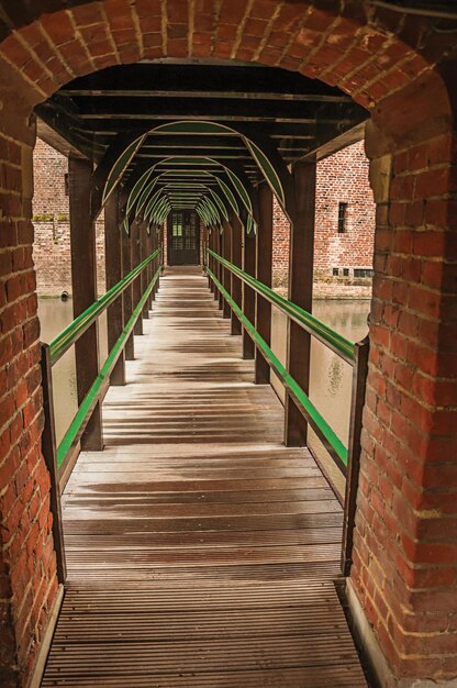 Wooden drawbridge and walkway at de haar castle near utrecht a gothic style castle in netherland