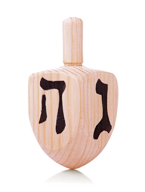 Photo wooden dreidel for hanukkah on white background