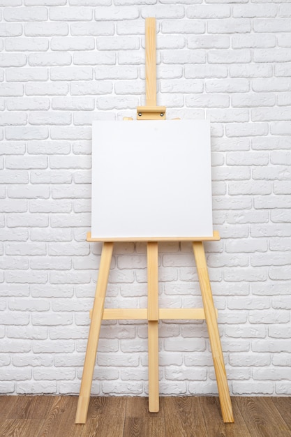 Wooden easel in the room