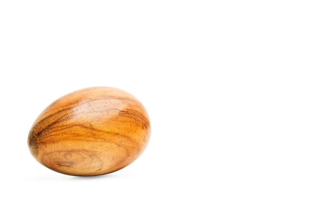 A wooden egg on a white background with copy space