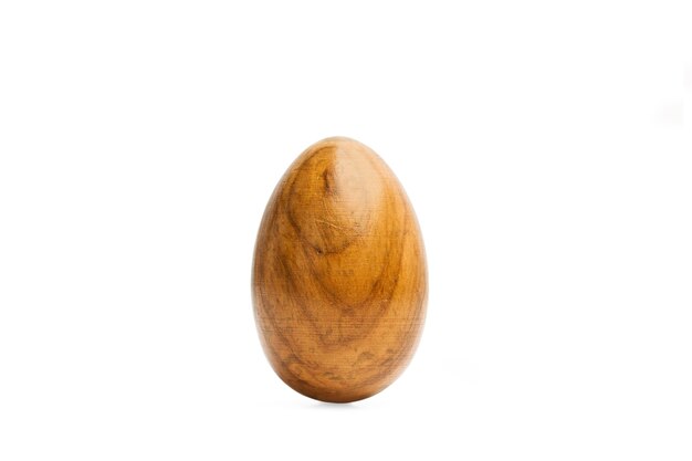 A wooden egg on a white background with copy space