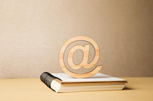 Wooden email sign on notepad