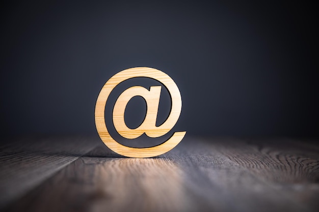 Wooden email sign on the wooden background