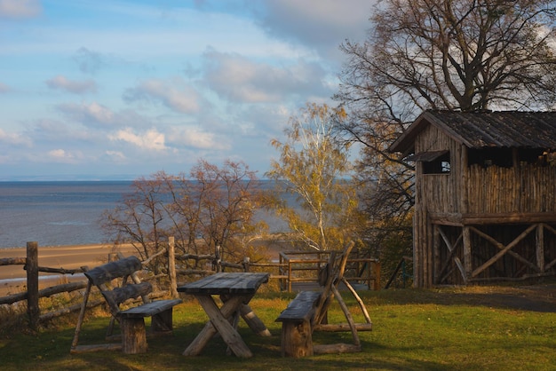 Wooden fence and a house on the banks of the Volga River