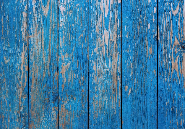 Wooden fence old blue color as a background or texture. Vintage painted wooden boards