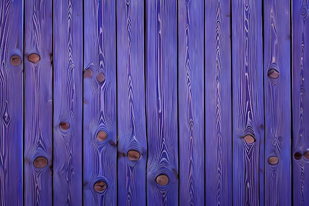 A wooden fence with a blue background that has a wooden plank that has a hole in it.