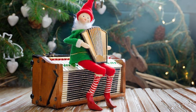 Photo a wooden figure of an elf sitting on an accordion