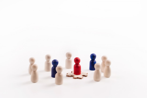 Wooden figure standing on the Jigsaw showing that it is an important part.