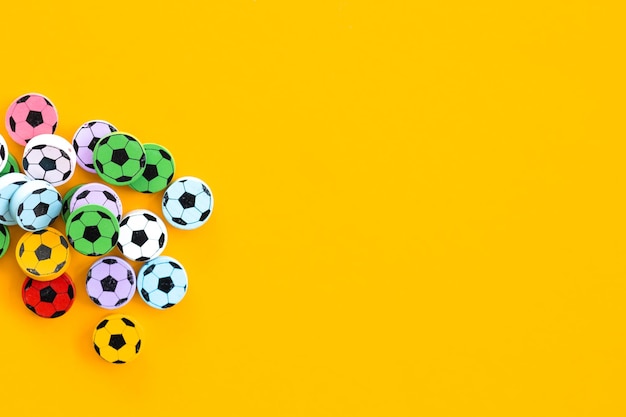 Wooden figures in the form of soccer balls on a yellow background