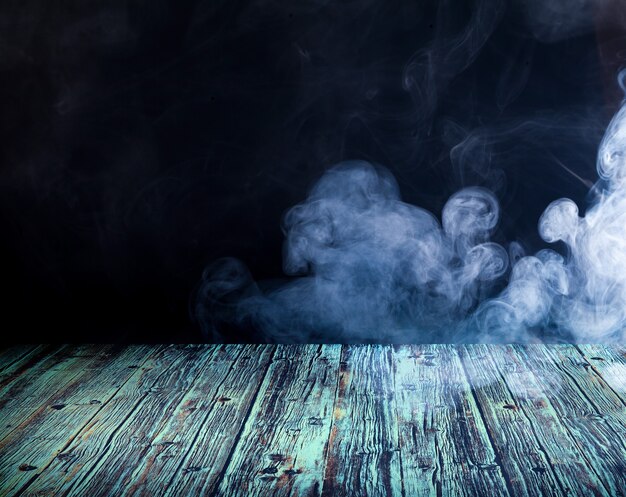 Photo wooden floor against the backdrop of clouds of smoke