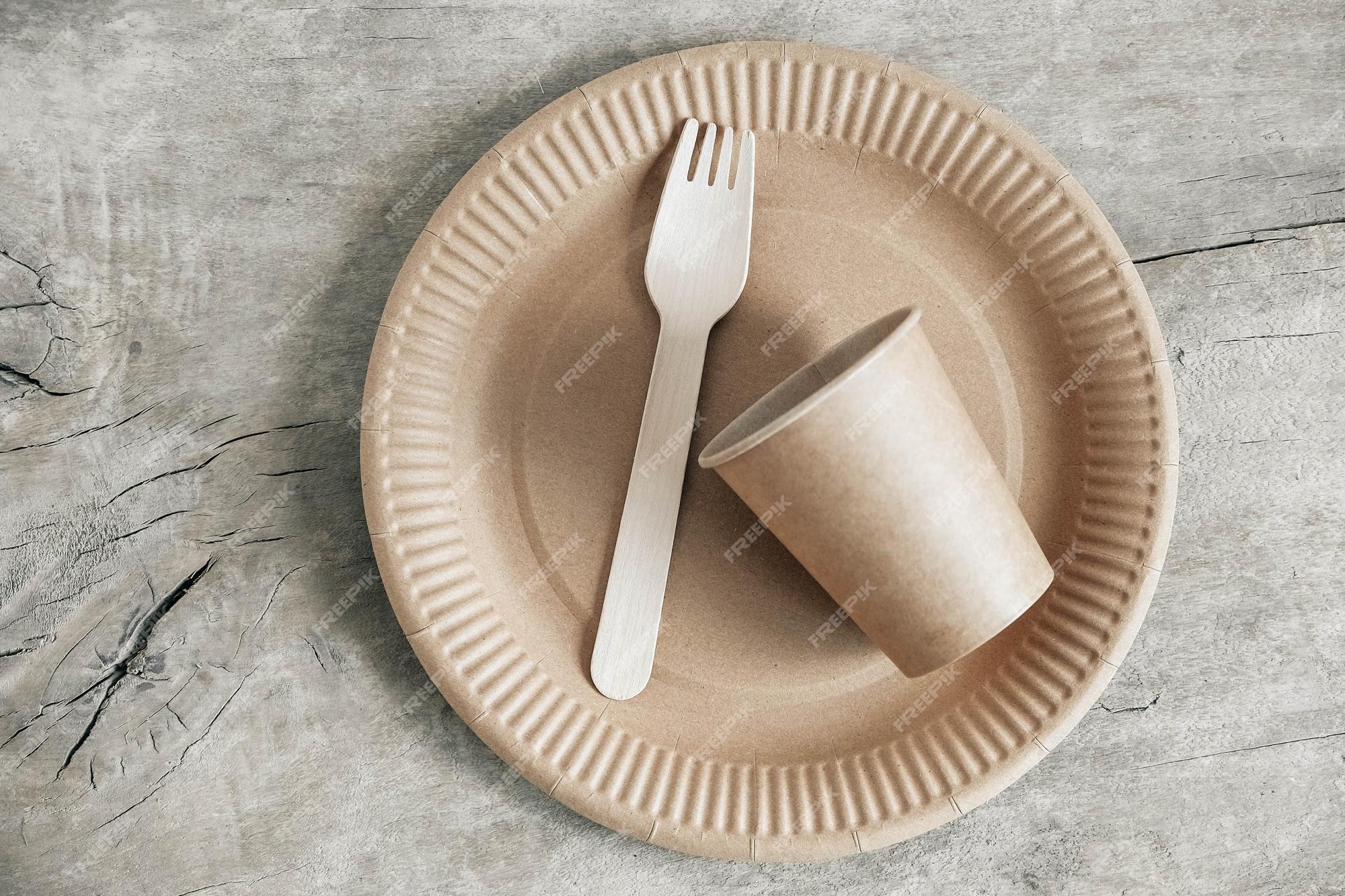 https://img.freepik.com/premium-photo/wooden-fork-paper-cup-with-plate-wooden-background-eco-friendly-disposable-tableware-also-used-fast-food-restaurants-takeaways-picnics-top-view-copy-empty-space-text_196938-3046.jpg?w=2000