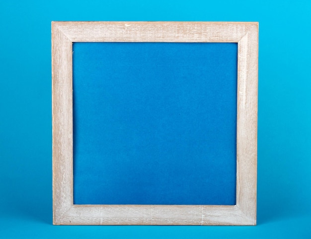 Photo wooden frame on color background