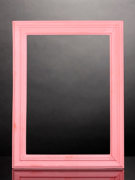 Wooden frame on grey background