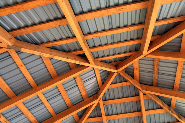 Wooden frame of new roof from inside. Construction framework.