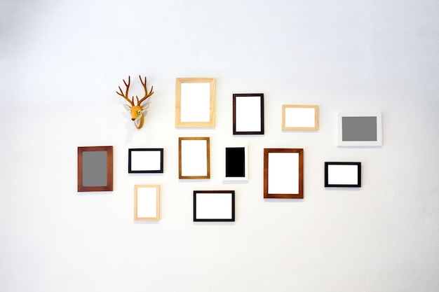 Wooden frame photo decorate on white cement wall