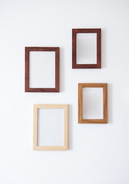 Wooden frame. Wood blank picture frames in different sizes on wall. Museum gallery mockup design, advertising painting image templates