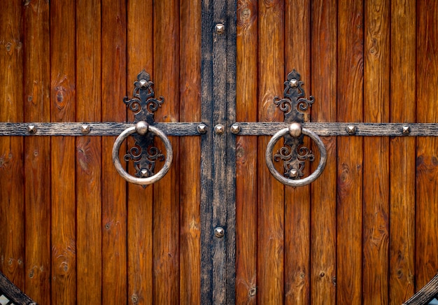 Wooden gate with wrought iron elements