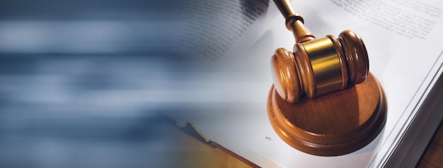 Wooden gavel and book on wooden table