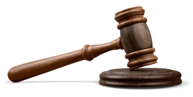 Wooden gavel on wooden table, on  background