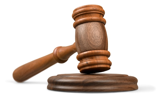 Wooden gavel on wooden table, on  background