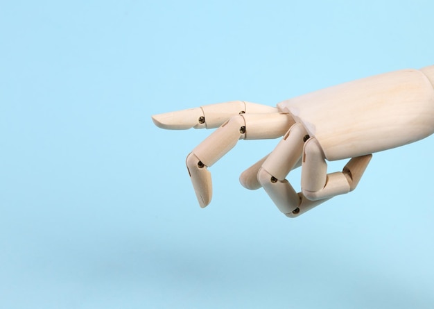 Wooden hand steps with fingers on a blue background