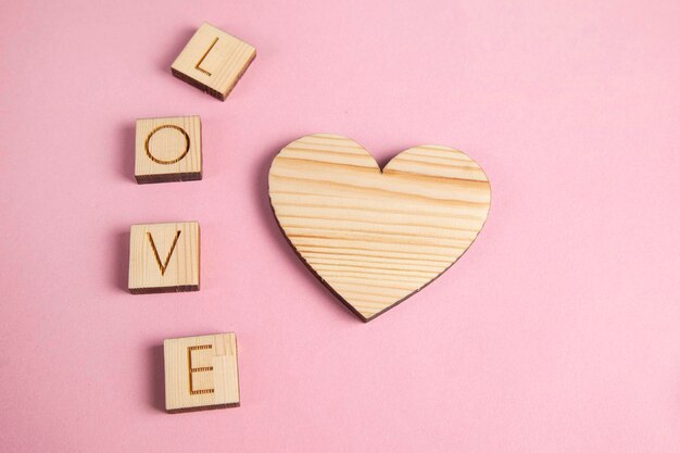 Wooden heart and love text