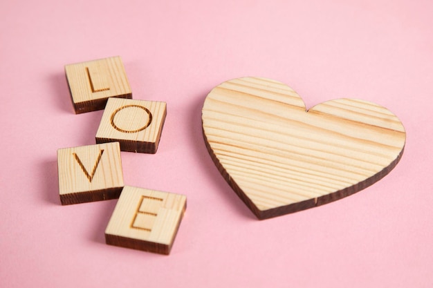 Wooden heart and love text