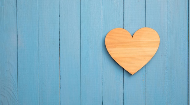 Wooden heart on wooden background