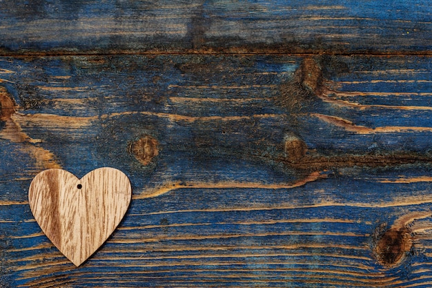 Wooden heart on wooden table