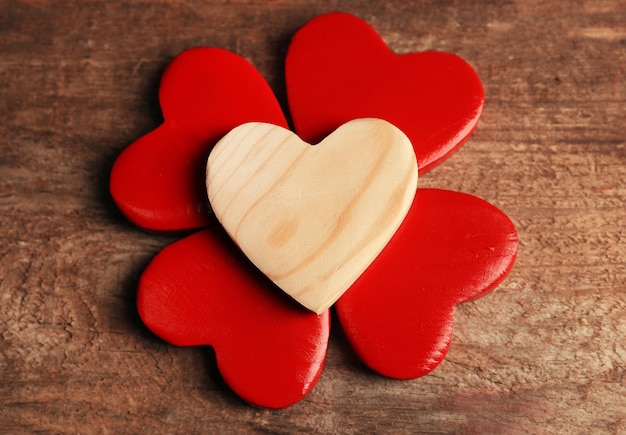 Wooden hearts on rustic wooden background